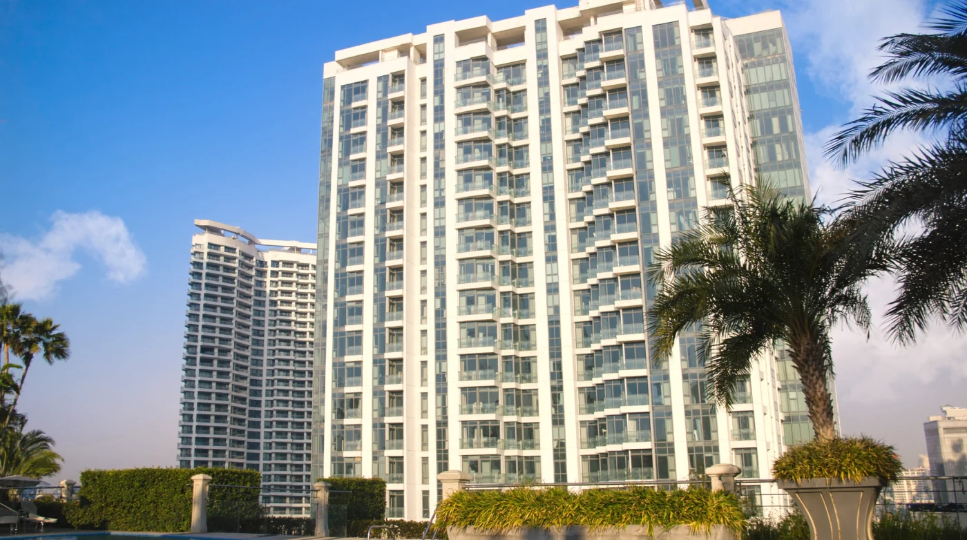 Bangkok condo towers with balconies seen across the skyline in afternoon light